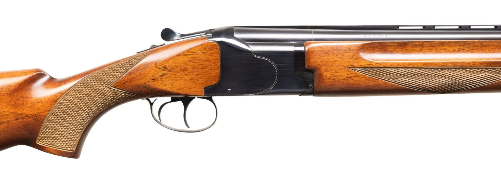 WINCHESTER MODEL 99 FIELD GUN O/U SHOTGUN WITH: MATCHING BOX. Cal. 12 Ga., 2 3/4". S# K374055. Mfg. in Japan. VR 28" bbls. brass bead; Imp. Mod. over Imp. Cyl. chokes. Plain blued receiver w/ dbl. triggers & ejectors. Checkered walnut stock set. UN