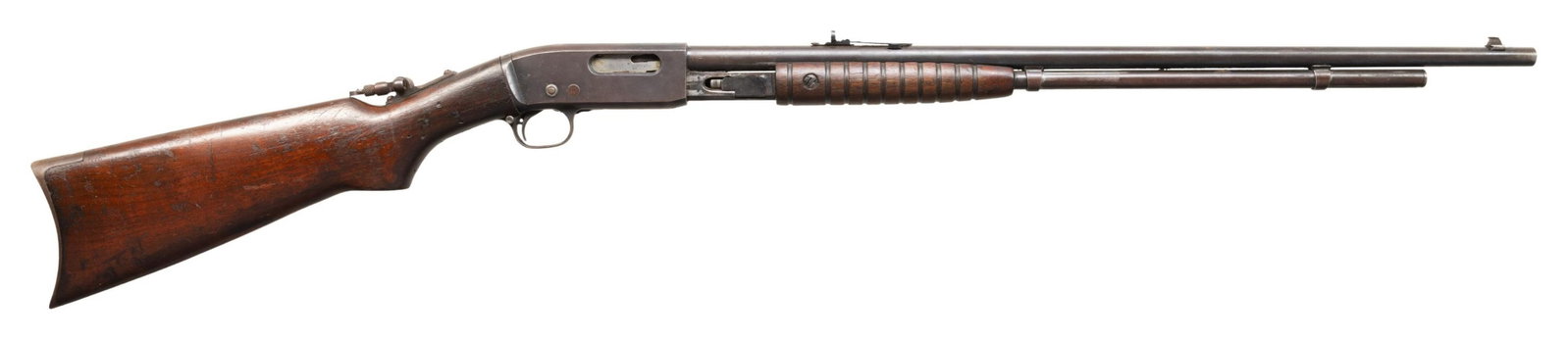 REMINGTON 25 SLIDE ACTION RIFLE.: Cal. 32 WCF. S# AA1960. Bbl. 24" with dovetailed bead front sight. Elevator adj rear sight. Added stock mounted tang peep sight. Semi pistol grip walnut stock with smooth crescent steel buttplate. CON