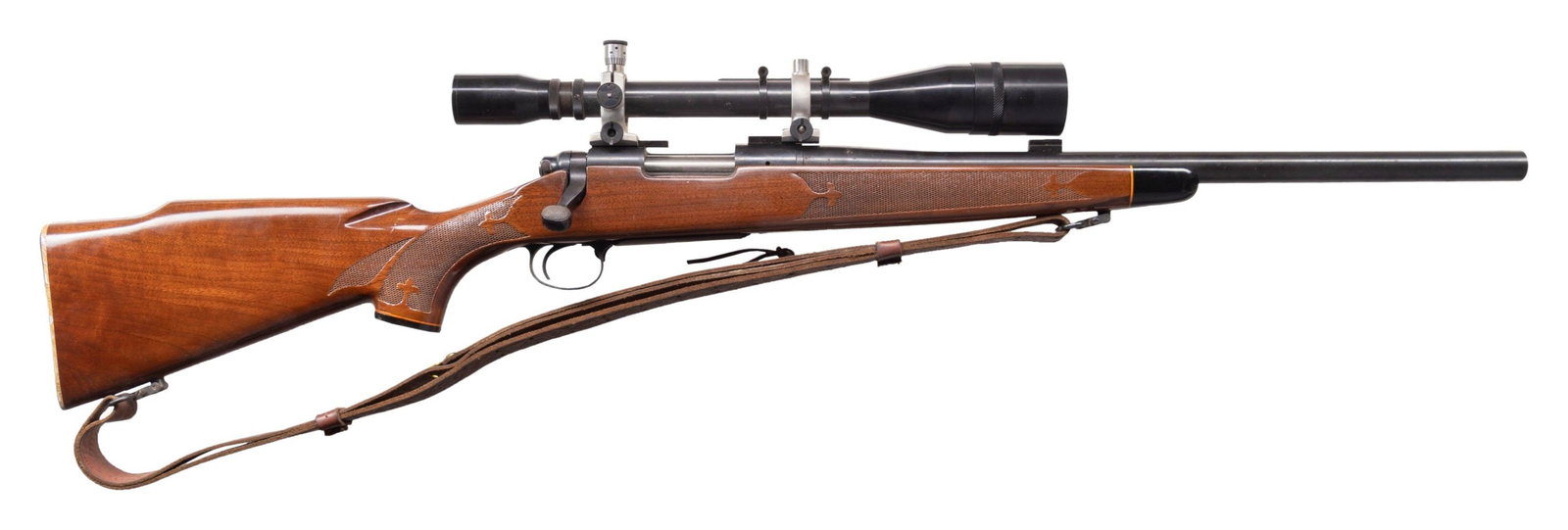 REMINGTON 700 BDL VARMINT BOLT ACTION RIFLE.: Cal. 222 Rem. S#258772. Bbl. Shortened to 20". Fitted with a Unertl 10x scope. Press checkered BDL stock with checkered aluminum buttplate and Q/D sling swivels. CONDITION: overall very good. 90% orig