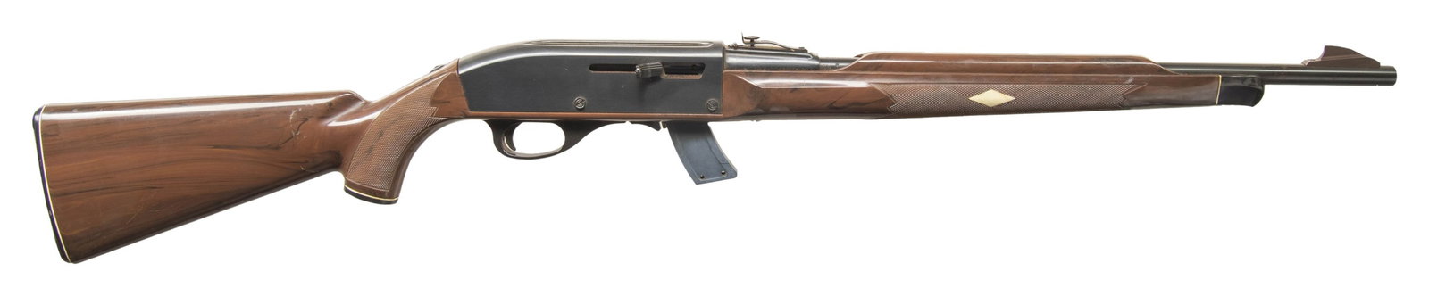 REMINGTON NYLON MOHAWK 10-C SEMI AUTO RIFLE.: Cal. 22 LR. S# 2499853. Approx. 129,000 mfg. 1971-1978. Bbl. 19 5/8". Sporting sights. Blued finish. Mohawk brown Zytel stock. MAGS: 1 - 10 rd. CONDITION: barrel has ring of cleaned oxidation behind f