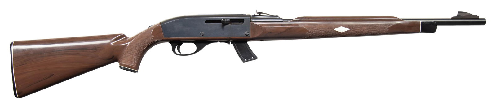 REMINGTON NYLON 10C MOHAWK SEMI AUTO RIFLE.: Cal. 22LR. S# 2550766. Bbl. 20". Standard configuration with Mohawk brown stock. MAGS: 1-10rd. CONDITION: overall very fine with only a few minor handling marks. Great bore. (26-1487/ZAL). MODERN.$400