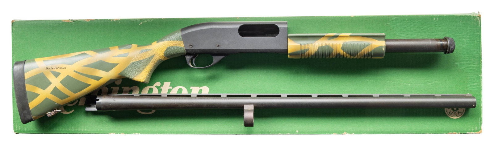 REMINGTON 870 MAGNUM DUCK'S UNLIMITED GUID GUN: WITH MATCHING FACTORY BOX. CAL. 12 GA., 2 3/4" & 3". S# DUGG-2418. VR 28" bbl. w/ steel bead; "PJ" code appears to indicate June 1988 mfg. Remchokes: Full, Mod, IC, Skeet included. Matte finish. Green