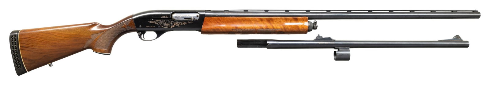 REMINGTON 1100 MAGNUM SEMI AUTO SHOTGUN.: Cal. 12ga 3". S# L908871M. Bbl. 30" matted VR with steel bead front sight. Factory machine engraved rec with added white filler. Press checkered walnut stock set with black plastic pistol grip cap, sl