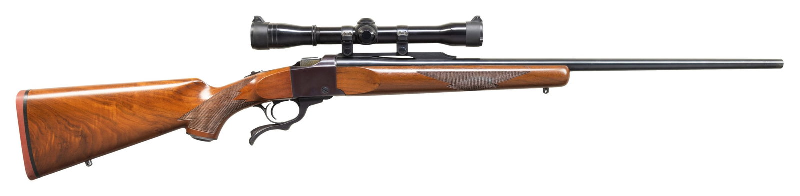 RUGER NO. 1-B SINGLE SHOT RIFLE.: Cal. 7mm Rem. Mag. S# 131-42107. 26" bbl without sights. Redfield Widefield 4x32 gloss finished scope with Duplex reticle on quarter rib with Ruger rings. Falling block action. Semi beavertail forend 
