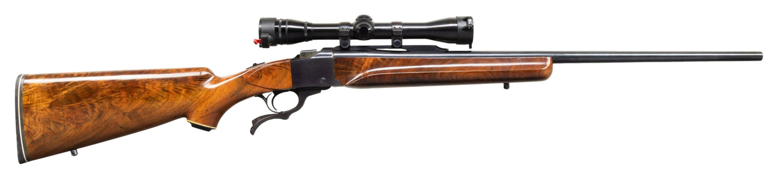 RUGER NO. 1-B CUSTOM STOCKED SINGLE SHOT RIFLE.: Cal. 30-06. S# 131-19394. 26" bbl without sights. Redfield 4x32 gloss finished scope with Duplex reticle on quarter rib with Ruger rings. Falling block action. Custom stocks of fancy gloss finished bl