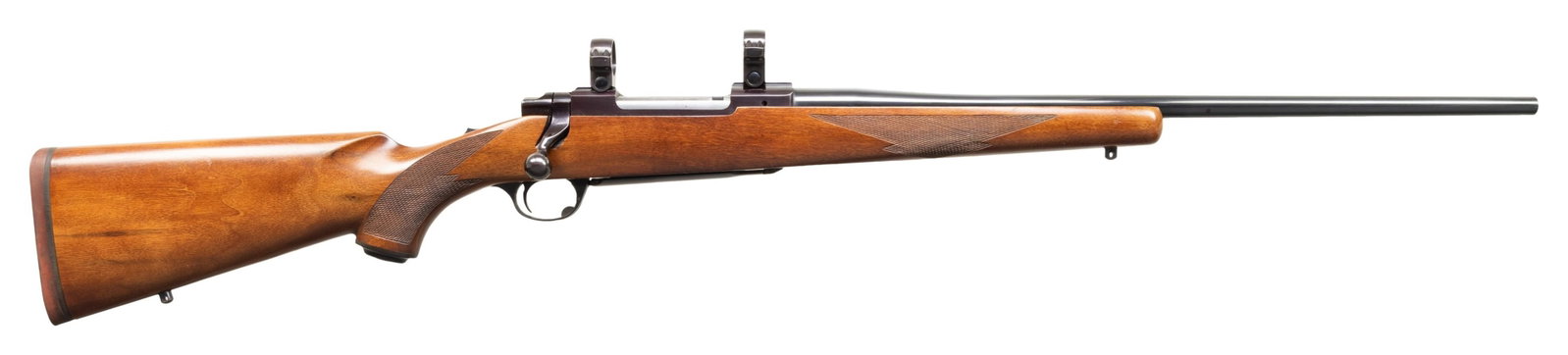 RUGER 7X57MM TANG SAFETY BOLT ACTION RIFLE.: Cal. 7x57MM. S# 72-79832. Bbl. 22" sporter without provision for sights; receiver factory machined for Ruger scope rings. Mfg. 1977 (1968-1992) with checkered walnut stock having Ruger logo grip cap, 