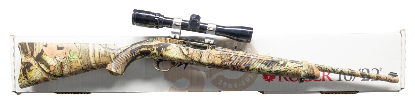 RUGER 10/22 50 YEARS MOSSY OAK INFINITY CAMOFLAUGE: SEMI AUTO RIFLE WITH MATCHING FACTORY BOX. Cal. 22 LR. S# 0001-05851. Bbl. 18.5". Gold bead front sight & folding rear sight. Rifle has completed coverage of Mossy Oak Infinite camoflauge pattern. Bus