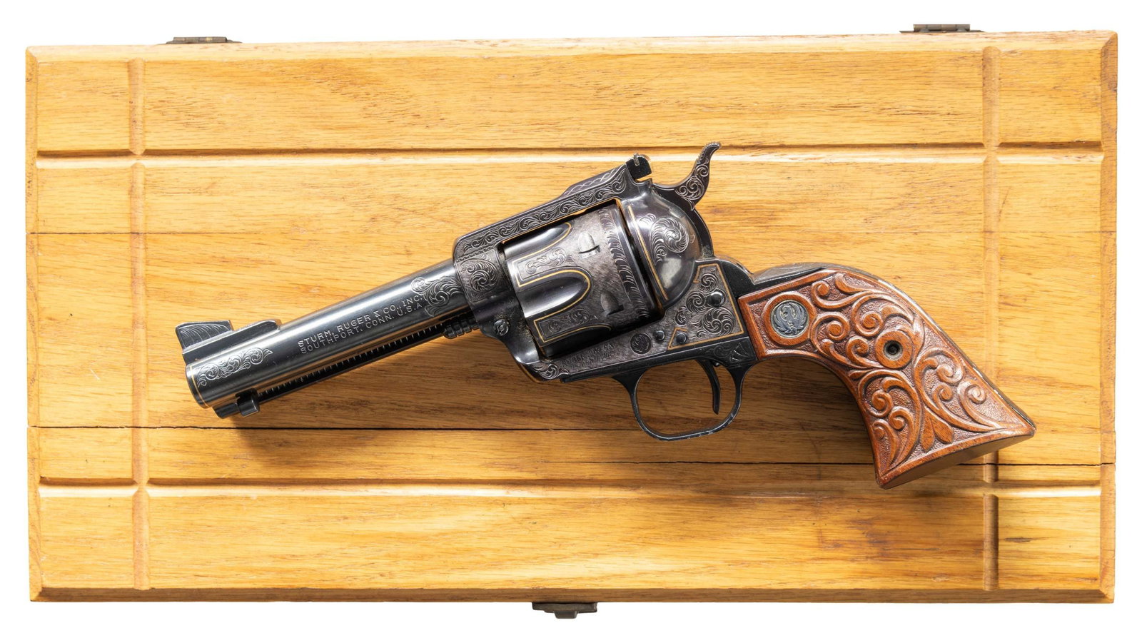 ENGRAVED RUGER OLD MODEL 357 BLACKHAWK REVOLVER.: Cal. 357 Mag. S# 30-99488. Bbl. 4 5/8" with ramped serrated front sight blade on base; frame mounted factory adjustable rear sight. Mfg. 1971 (1962-1973) with protected rear sight frame, XR3-RED alloy