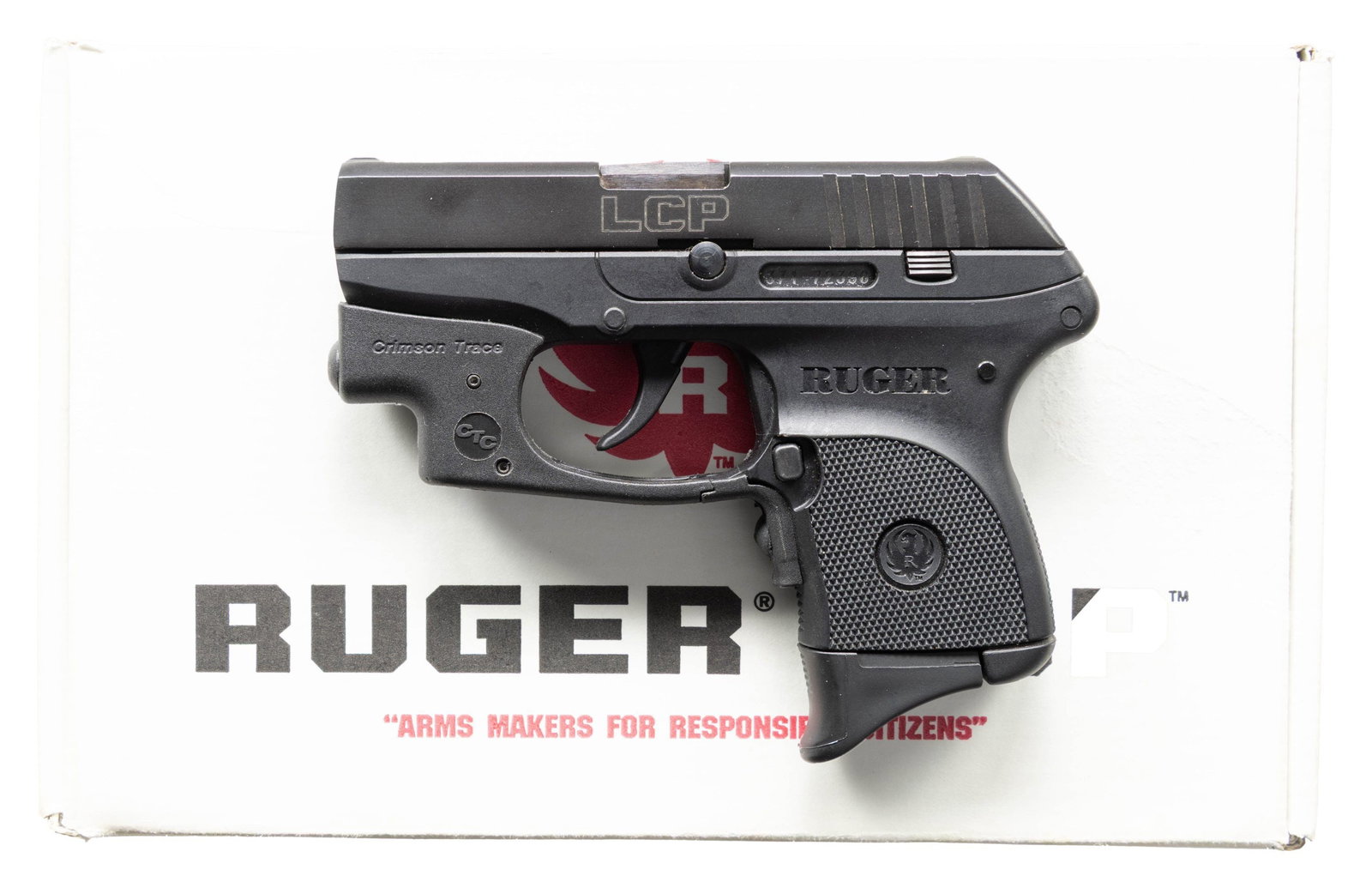 RUGER CTC LASER SIGHTED LCP SEMI-AUTO PISTOL.: Cal. 380 ACP. S# 371-72396. Bbl. 2.75". Mfg. 2009 (2008 to date) as Model 03701 having High Performance Glass Filled Nylon frame. Hammer firing mechanism concealed in rear of slide having integral fix