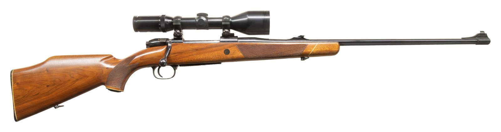 MAUSER MODEL 2000 BOLT ACTION RIFLE.: Cal. 30-06. S# 69591. 24" light sporter weight bbl. Band & ramp mounted bead front with folding leaf rear sight. Tasco Euro-Class 30mm tube 3-12x56 scope with 3 post reticle on Weaver mounts. 2 lug ac
