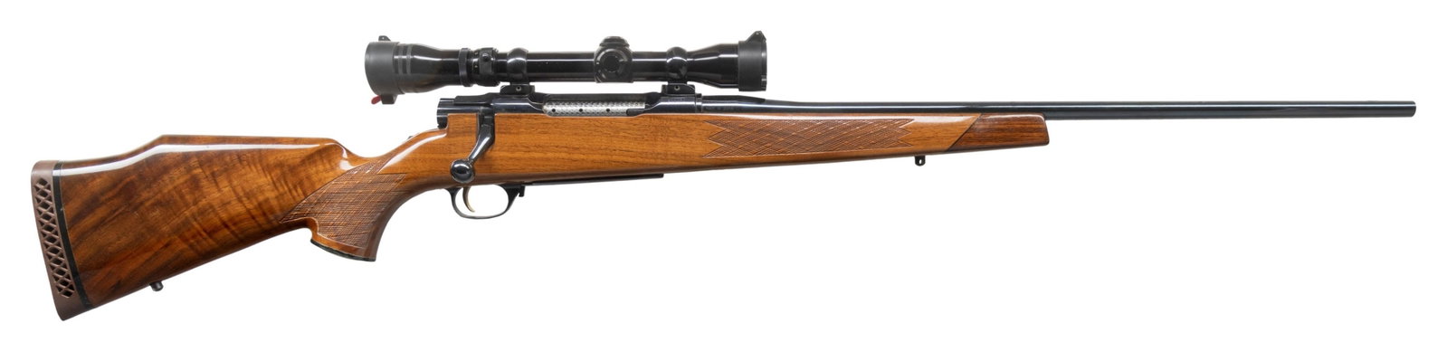 NIKKO GOLDEN EAGLE MODEL 7000 BOLT ACTION RIFLE.: Cal. 30-06. S# 000067. 24" medium sporter weight bbl without sights. Redfield Widefield 2-7X32 gloss finished scope with duplex reticle on 2 pc mounts. Action has 5 rear locking with a jeweled bolt bo