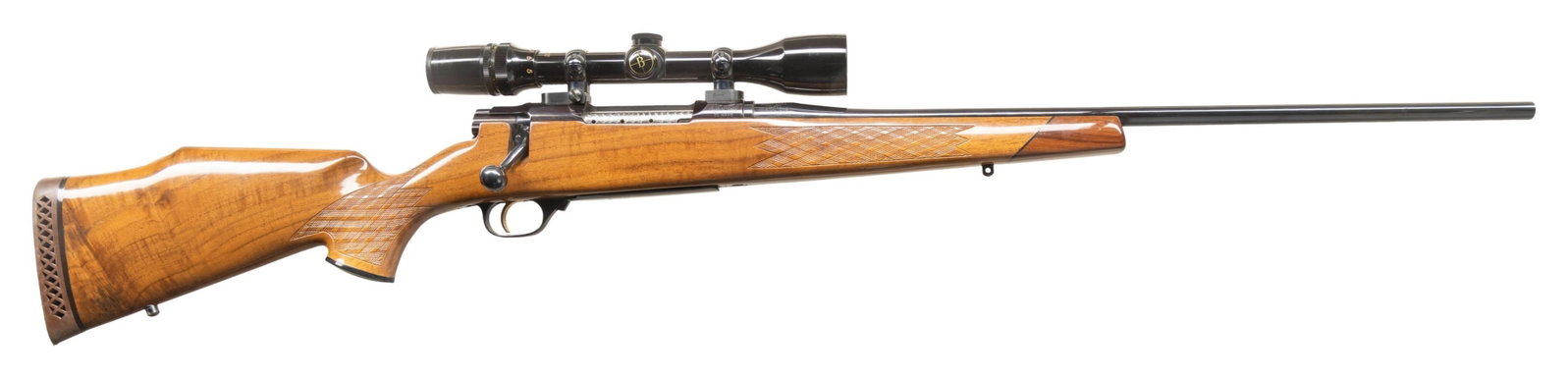 NIKKO GOLDEN EAGLE MODEL 7000 BOLT ACTION RIFLE.: Cal. 7mm Rem Mag. S# NO21140. 24" bbl sightless. Bushnell Scope Chief VI, 3-9x42 gloss finished scope with Duplex reticle on 2 pc Burris mounts. 5 rear locking lug action features a jeweled bolt body 