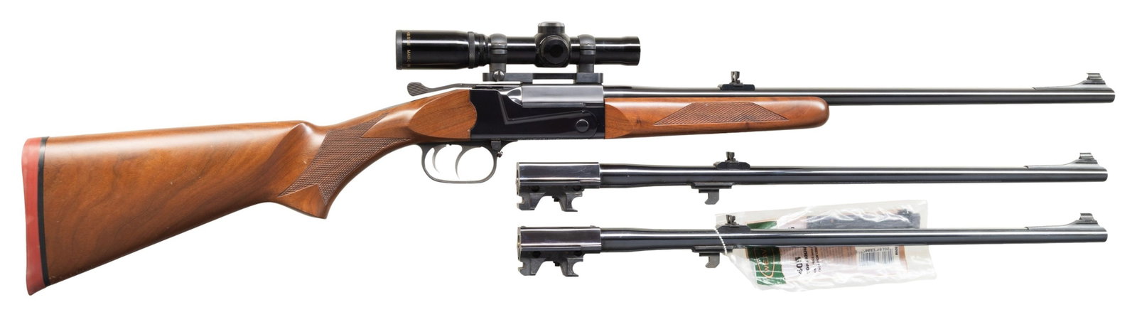THOMPSON/CENTER TCR 83 SINGLE SHOT RIFLE WITH 2: EXTRA SETS OF BARRELS. Cal. 22 Hornet. S# 3177. 23" ramp mounted bead front bbl with folding leaf rear sight. Burris 4x20 Mini Scope with Duplex reticle on Burris 1 pc mount. Top lever operated single