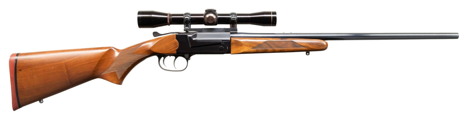 THOMPSON/CENTER TCR 83 SINGLE SHOT RIFLE.: Cal. 7mm Rem Mag. S# 10847. 23" bbl without sights. Leupold M8, 4x32 gloss finished scope with dot reticle on 1 pc Redfield base. Top lever break open action with double set triggers is marked "MAG" o