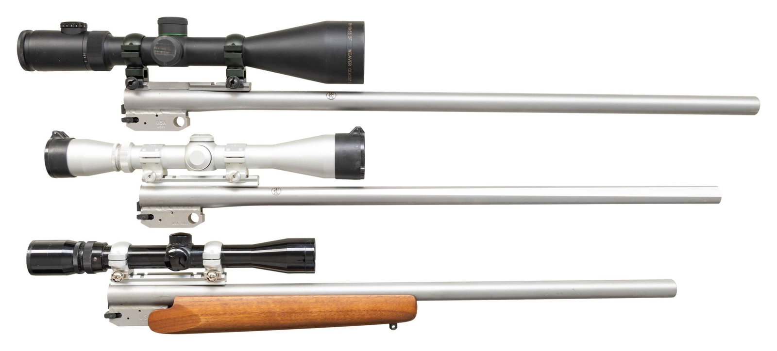 3 THOMPSON CENTER ENCORE RIFLE BARRELS BY MGM.: All are scoped stainless barrels with split locking blocks and recessed target crowns. 1). 24" round in 22 TCM caliber with 1 in 12" twist rate. Bottom of barrel drilled and tapped for its plain