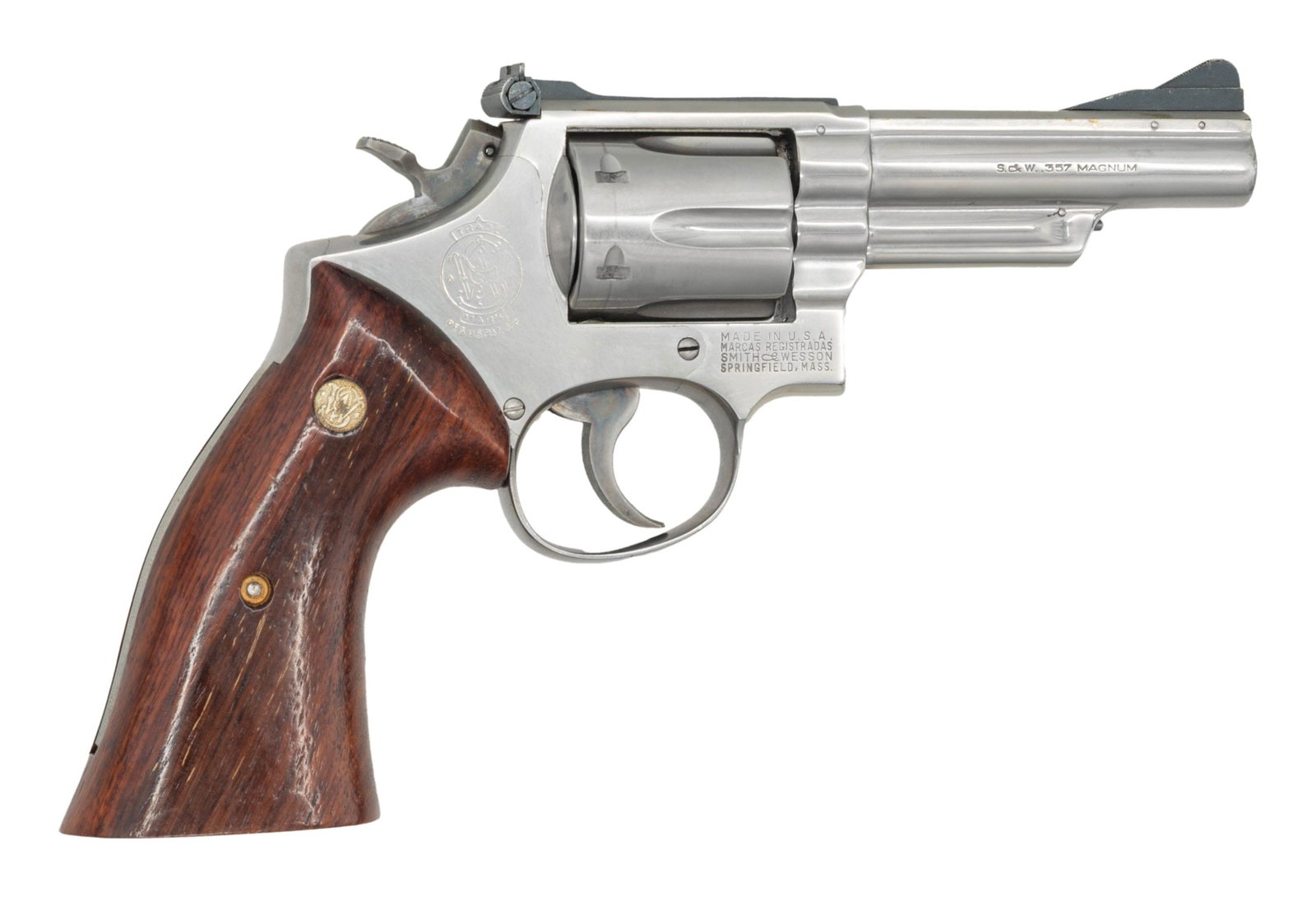 EARLY SMITH & WESSON COMBAT MAGNUM DA REVOLVER.: Cal. 357 Mag. S# K264859. Bbl. 4" pinned. Ramped serrated blade front sight. Fixed square notch rear sight. Matching numbers on frame, bbl., cyl. & extractor. First year 1955 made Combat Magnum revolv