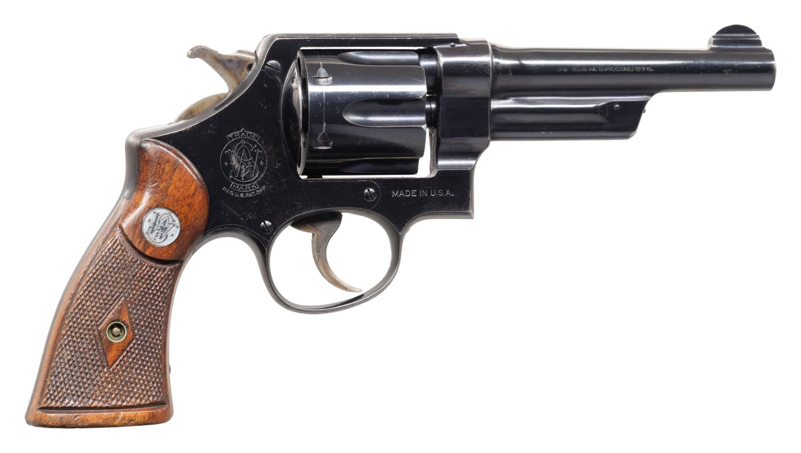 PREWAR SMITH & WESSON 38/44 HEAVY DUTY DA: REVOLVER. Cal. 38 Spl. S# 60711. Bbl. 5" pinned. Round blade front sight. Fixed rear sight. Matching numbers on frame, bbl., cyl., extractor & right grip panel. Blued finish with case colored hammer &