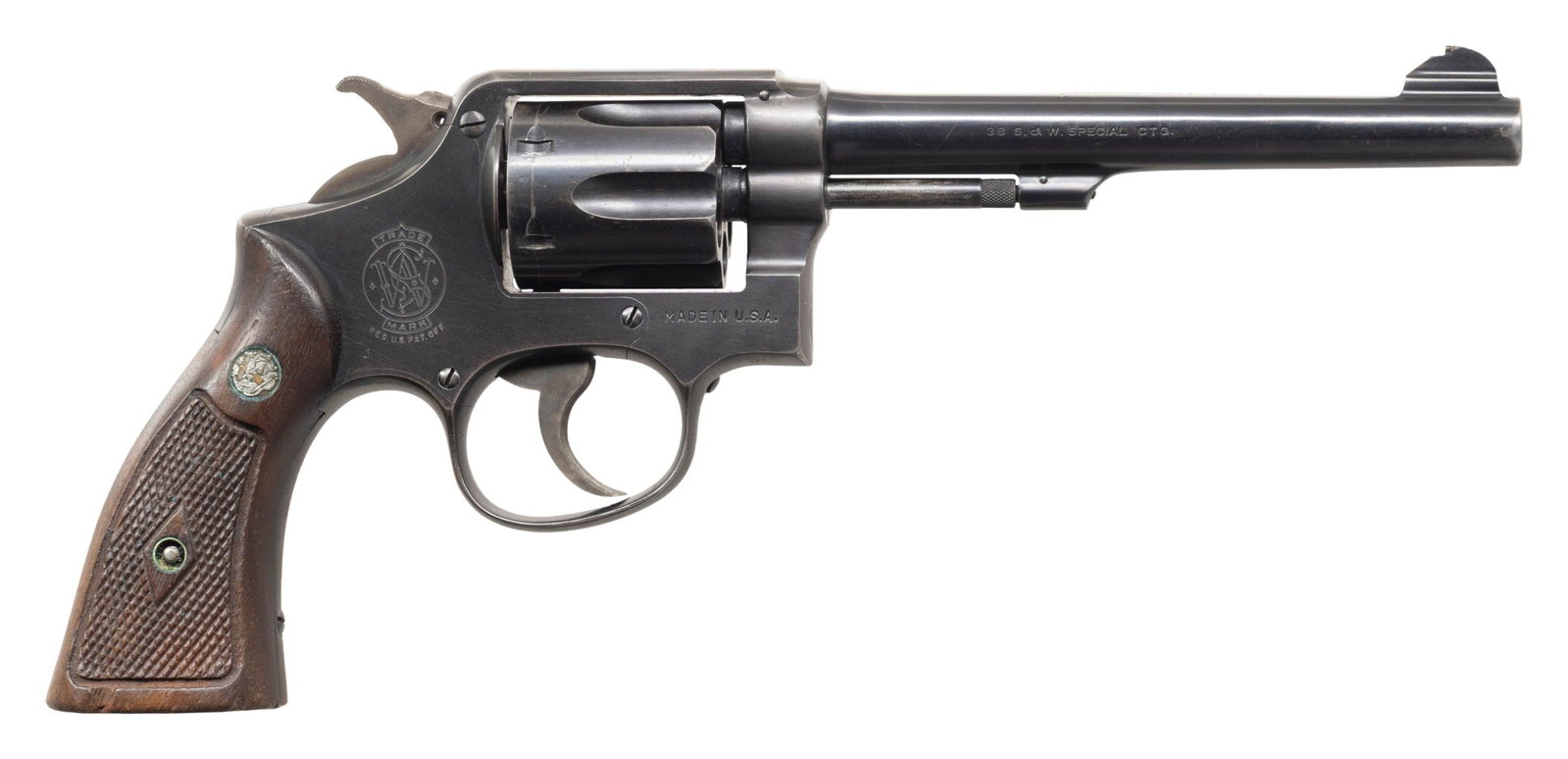 SMITH & WESSON 38 HE DA REVOLVER.: Cal. 38 Spl. S# S911306. Bbl. 6". Ramped front sight with bead. Fixed rear sight. Matching numbers on frame, bbl., cyl., extractor & right grip panel. 6-shot cyl. 1945-1948 made M&P Hand Ejector. Blue