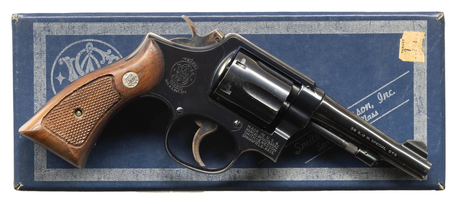 SMITH & WESSON MODEL 10-5 DA REVOLVER.: Cal. 38 Spl. S# C872598. Bbl. 4" pinned. Ramped blade front sight. Fixed rear sight. 6-shot cyl. Blued finish with case colored hammer & trigger. Checkered walnut grips with silver S&W medallions. Rig