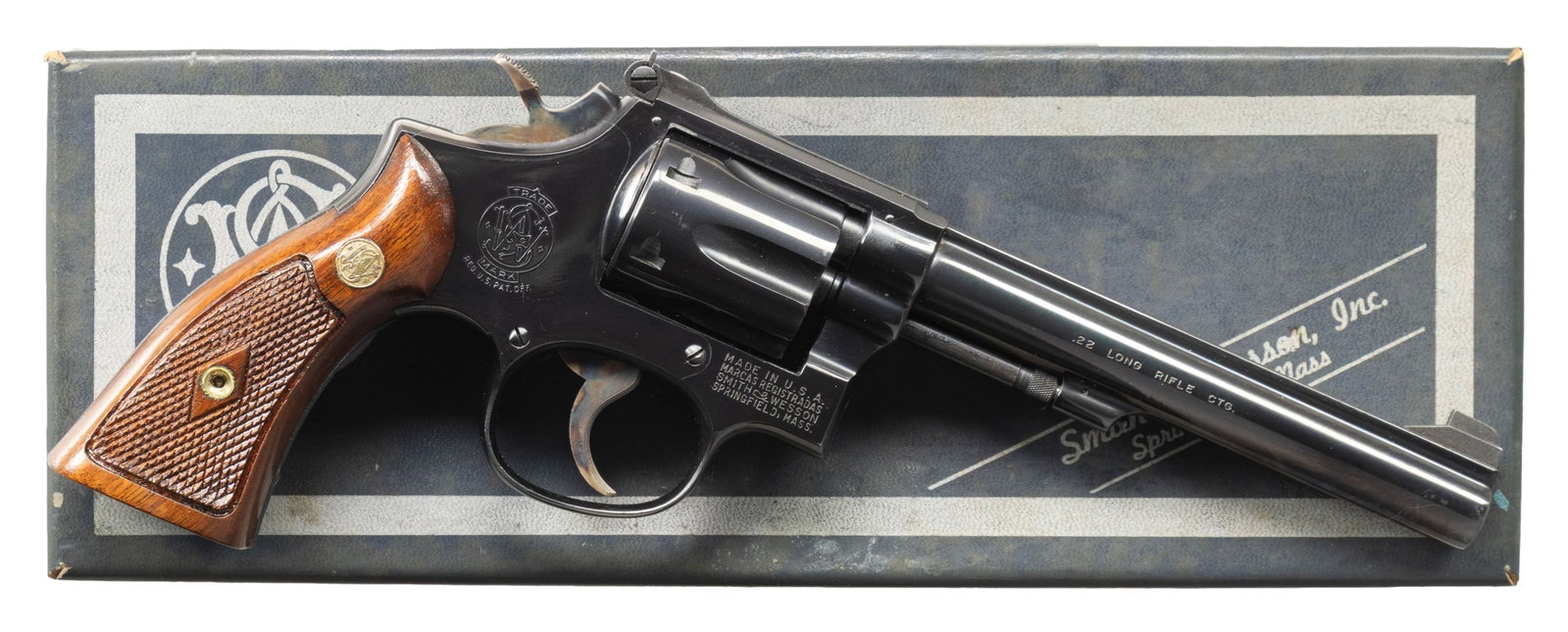 SMITH & WESSON MODEL 17-2 DA REVOLVER.: Cal. 22 LR. S# K634021. Bbl. 6" pinned. Patridge front sight. Adjustable square notch rear sight. 1965 made 17-2 revolver. 6-shot recessed cyl. Blued finish with case colored hammer & trigger.