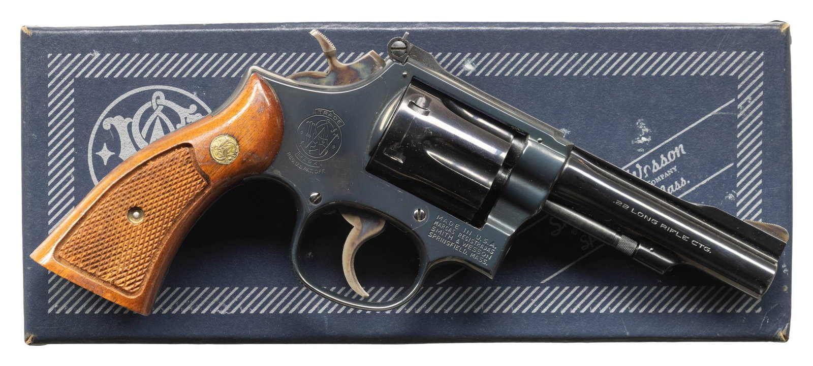 SMITH & WESSON MODEL 18-4 DA REVOLVER.: Cal. 22 LR. S# 32K0503. Bbl. 4" pinned. Ramped serrated blade front sight. Adjustable square notch rear sight. 6-shot recessed cyl. 1978-1979 made revolver. Blued finish with case colored hammer &
