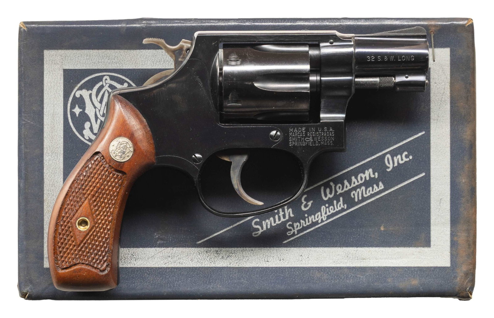 SMITH & WESSON MODEL 30-1 DA REVOLVER.: Cal. 32 S&W Long. S# 741305. Bbl. 2" pinned. Ramped serrated blade front sight. Fixed rear sight. 5-shot cyl. Flat latch. Blued finish with case colored hammer & trigger. Checkered walnut diamond cent