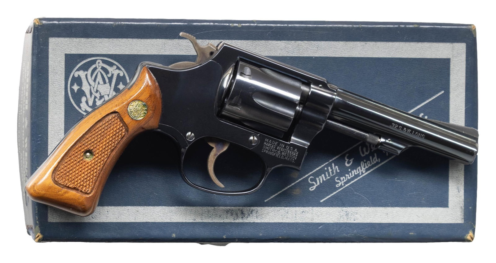 SMITH & WESSON MODEL 31-1 DA REVOLVER.: Cal. 32 S&W Long. S# H4977. Bbl. 4" pinned. Ramped serrated blade front sight. Fixed rear sight. 6-shot cyl. Blued finish with case colored hammer & trigger. Checkered walnut grips with matching numbe