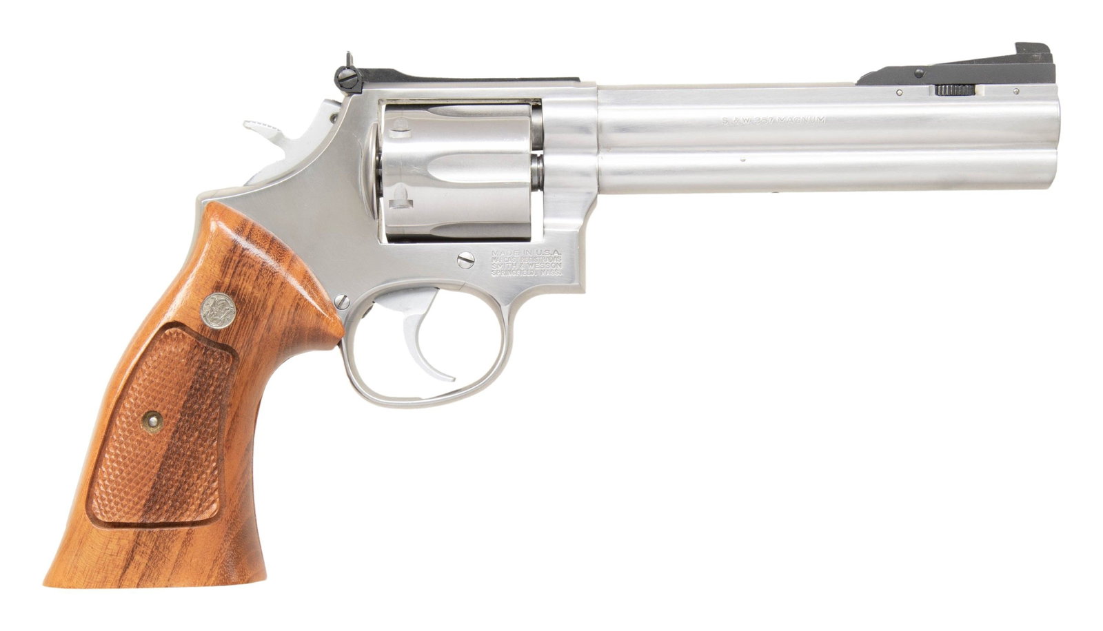 SMITH & WESSON MODEL 686-3 DA REVOLVER.: Cal. 357 Mag. S# BFS5443. Bbl. 6" with full underlug. Aftermarket adjustable patridge front sight. Adjustable square notch rear sight. 6-shot cyl. Stainless finish with hard chrome hammer & smooth fac