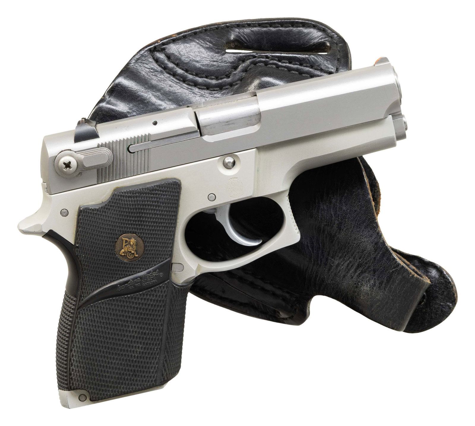 SMITH & WESSON MODEL 669 SEMI AUTO PISTOL.: Cal. 9x19. S# TAW4377. Bbl. 3 1/2". Ramped blade front sight with added orange paint. Square notch rear sight with white outline. Stainless finish. Pachmayr Signature Model grips. MAGS: 2 - 12 rd. UNA