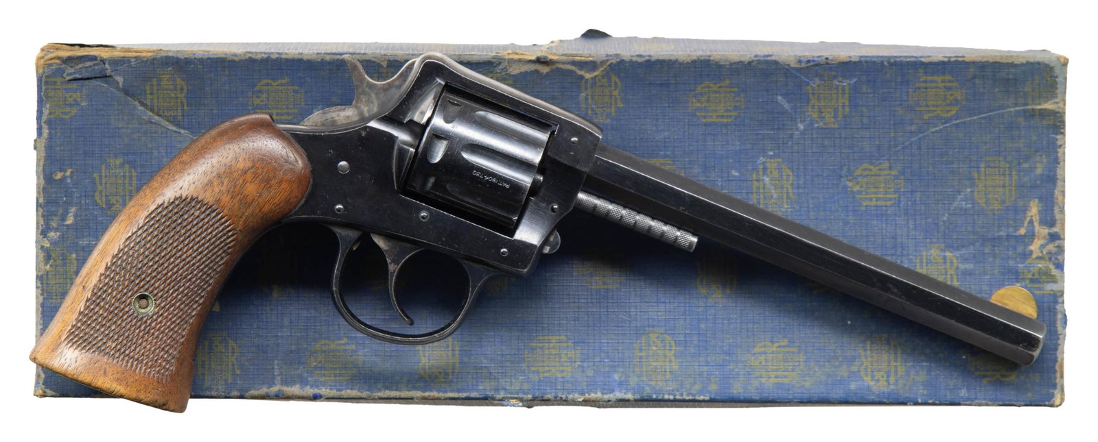 HARRINGTON & RICHARDSON MODEL 922 DOUBLE ACTION: REVOLVER WITH FACTORY BOX. Cal. 22 LR. S# 167222. Bbl. 6". Model 922 double action revolver mfg. by Harrington & Richardson. Left quarter flat of the octagonal bbl. is marked with H&R's mfg. informati