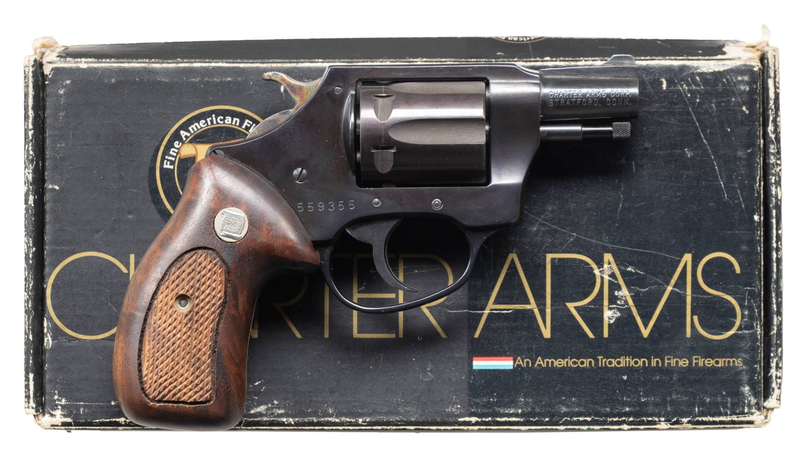 CHARTER ARMS MODEL 1322 UNDER COVER REVOLVER: WITH BOX. Cal. 32 S&W. S# 559355. Bbl. 2". Blued finish. 6 Shot cyl. Checkered wood grips. UNATTACHED ACCESSORIES: box. CONDITION: near excellent. (26-105/MD). MODERN. $250-350.