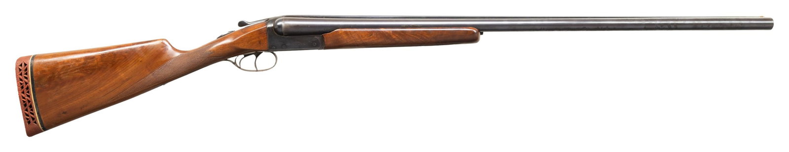 REMINGTON 1894 FE TRAP GRADE HAMMERLESS SXS: SHOTGUN. Cal. 12ga. S# P133239. Bbl. 30" with white bead front sight, matted rib and engraved "Trap Gun F Grade" & "Remington Arms Co. Ilion, NY". Rec is decorated with borderline engraving with scrol
