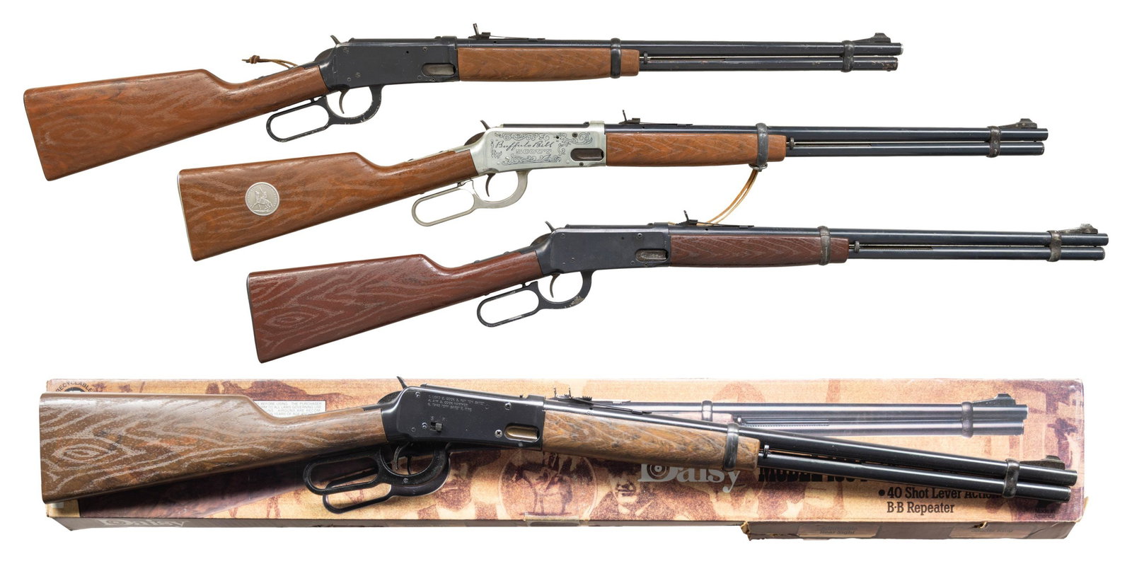FOUR DAISY MODEL 1894 STYLE LEVER ACTION BB: RIFLES. 1) MODEL 30-30 BUFFALO BILL SCOUT WESTERN CARBINE. Cal.175/BB. NSN. Lever action 40 shot repeater. Painted bbl. & false mag. tube. Adj. rear sight. Silver finished action and aluminum lever. S