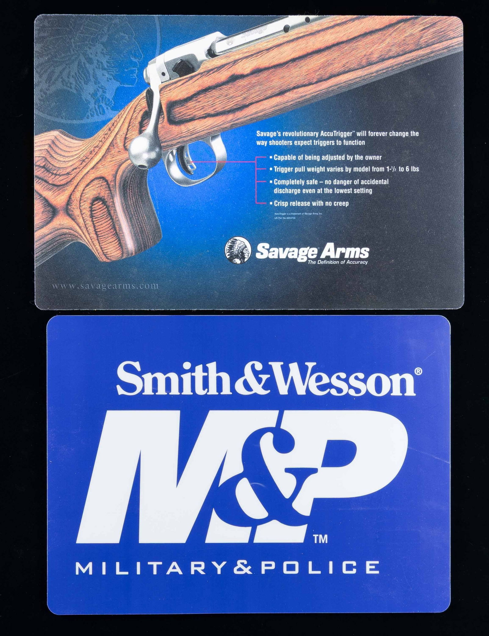2 COUNTER MATS: SAVAGE PLUS SMITH & WESSON.: Both appear new and are about 12" by 17". Savage mat is promoting the accolades of the "Accutrigger". / Smith & Wesson mat simply states "M & P" plus "Military & Police". PROVENANCE: Norman Olliff Est