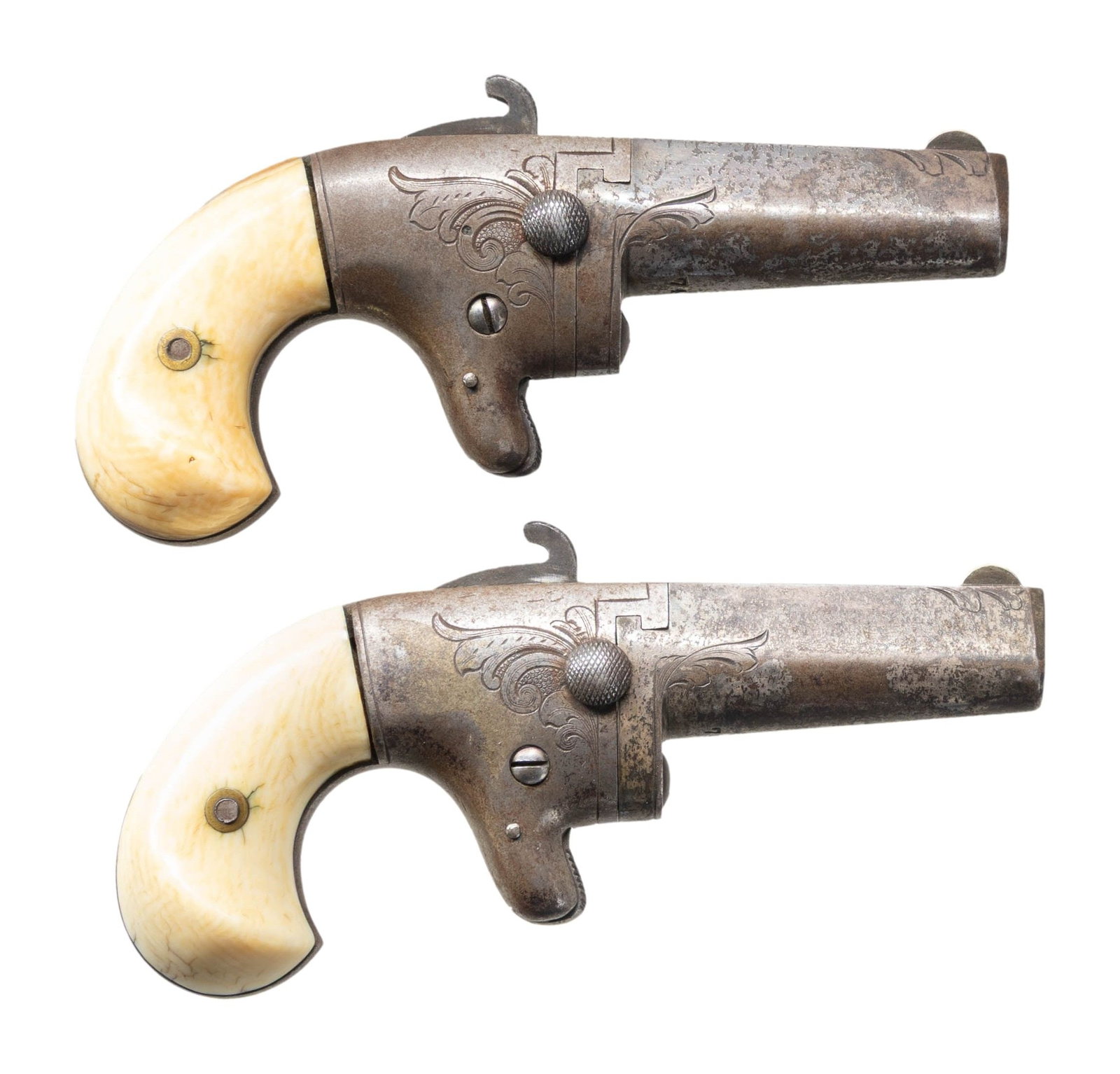 PAIR OF NATIONAL ARMS CO. SECOND MODEL DERRINGER: PISTOLS. 1) Cal. 41. S# 7436. Bbl. 2 1/2". Second Model derringer pistol mfg. by National Arms Co. Top of the bbl. is marked with National Arms' mfg. information. S# "7436" is marked on the underside