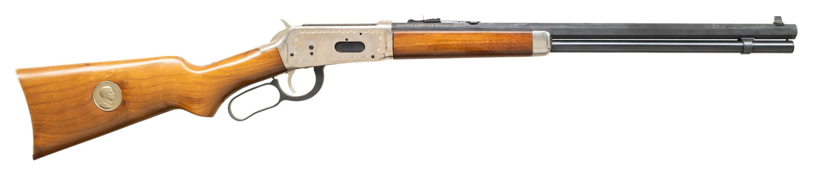 WINCHESTER 94 THEODORE ROOSEVELT COMMEMORATIVE: LEVER ACTION CARBINE. Cal. 30-30 Win. S# TR38836. Bbl. 20" Oct. with dovetailed bead front sight. Ladder adj rear sight. Nickel plated commemorative engraved rec. with saddle ring. Smooth pistol grip