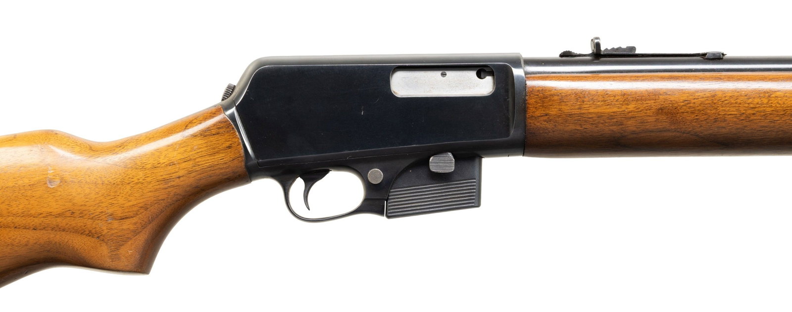 WINCHESTER 07 SEMI AUTO RIFLE.: Cal. 351 Win. S# 52080. Mfg. 1957. Bbl. 20" rd. Nice high condition example with dovetailed blade front sight. Ladder adjustable sporting rear sight. Blued finish. Smooth walnut stock set. Sling swive