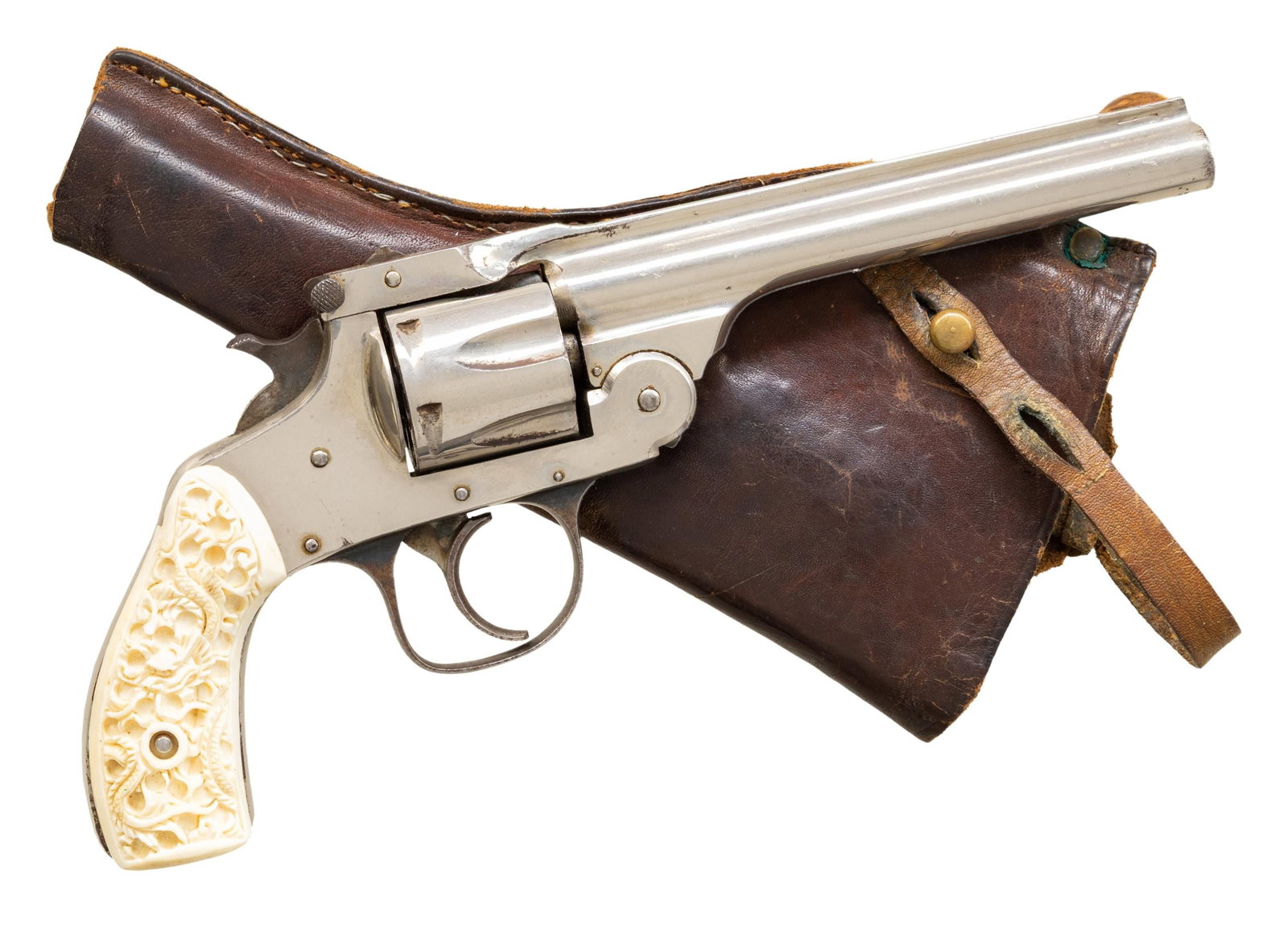 FOREHAND ARMS. TOP BREAK DA REVOLVER.: Cal. 32 S&W. S# 303690. Bbl. 5". Nickel finish. 6 Shot fluted cyl. Two piece white plastic grips having carved dragon motifs. UNATTACHED ACCESSORIES: hobbiest produced brown leather holster. CONDITION