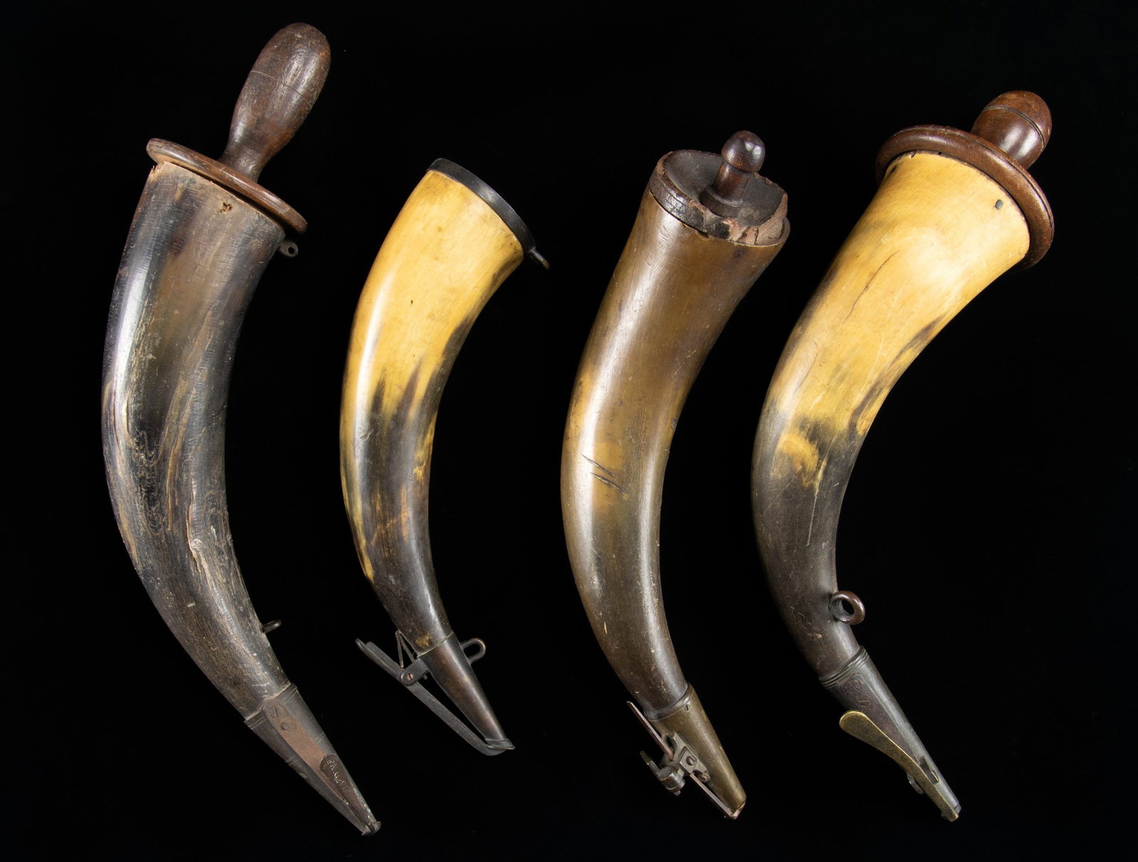 FOUR LARGE EARLY PRIMING HORNS. (1 of 2)