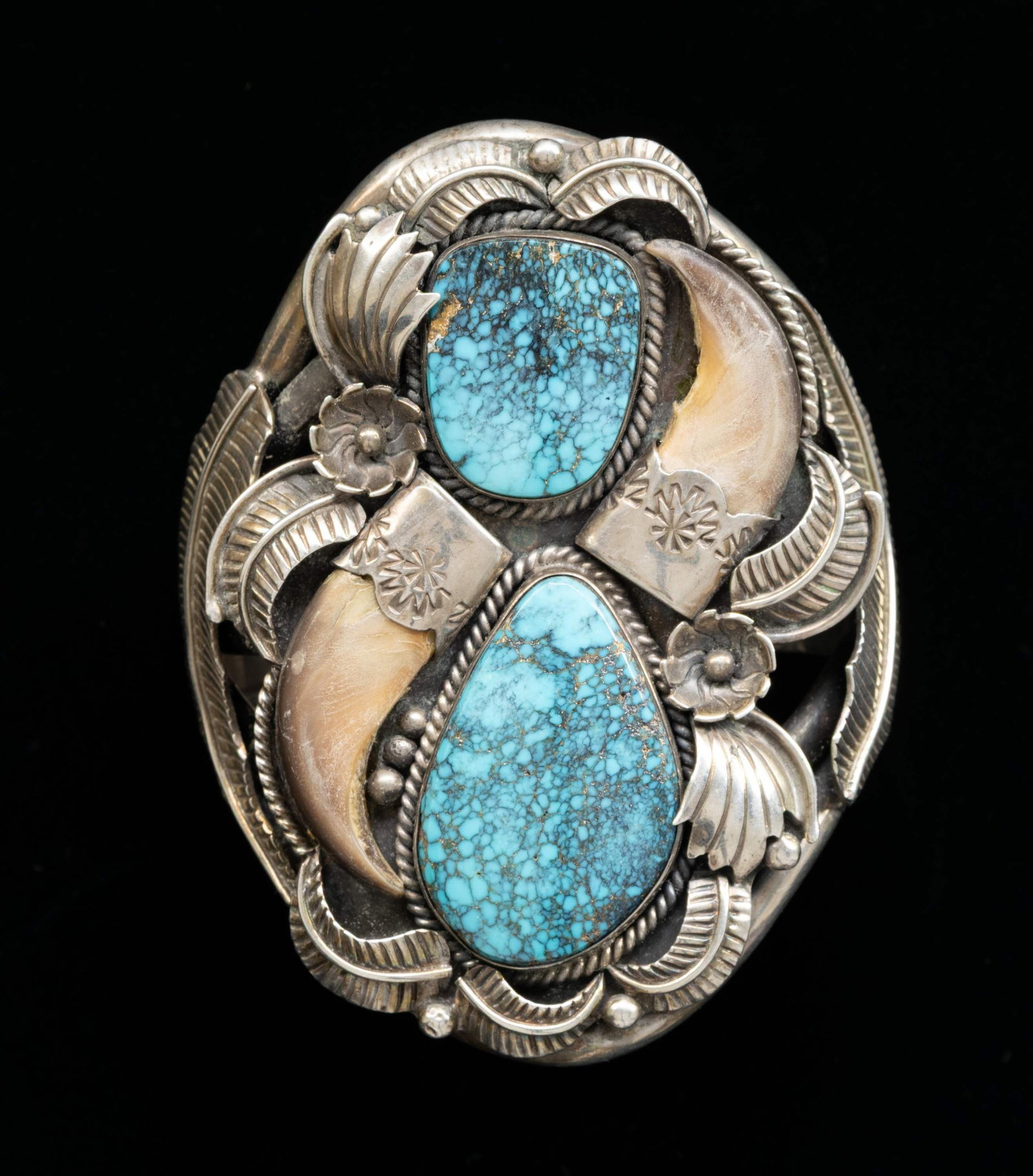 LARGE JOHN HARTMAN SIGNED TURQUOISE & BEAR CLAW: BRACELET. Circa 1970, bearing marks of Little Bert King Trading Store in Albuquerque, and maker monogram of John Hartman (anglo), 158 grams. CONDITION: good. (02-27020-2/JS). NON-GUN. $200-400.