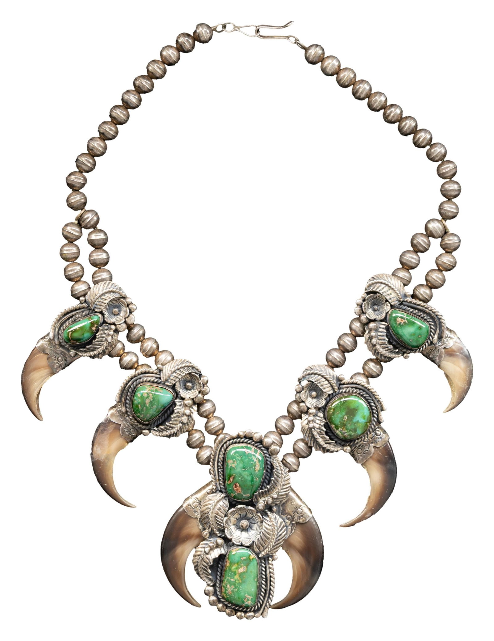 SIGNED STERLING SILVER NAVAJO GREEN TURQUOISE &: BEAR CLAW SQUASH BLOSSOM. 17" overall, total weight 172 grams. CONDITION: good, one claw has eroded edge. (02-27022-1/JS). NON-GUN. $300-500.