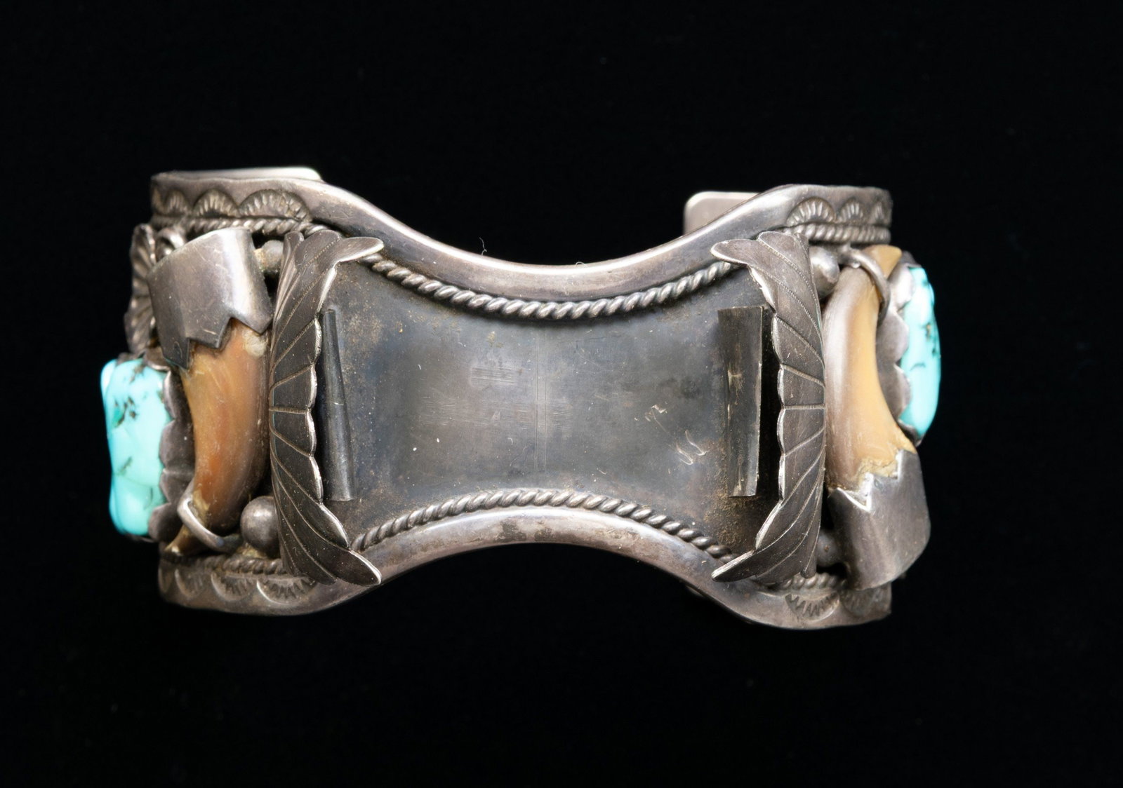 LARGE SIGNED STERLING NAVAJO TURQUOISE & BEAR CLAW: BRACELET FOR WATCH. 6" x 1.5" turquoise and bear claw decorated sterling bracelet to hold large man's rectangular watch (~1.5"), signed "DC / STERLING", 78 grams. CONDITION: good. (02-27028-2/JS). NON