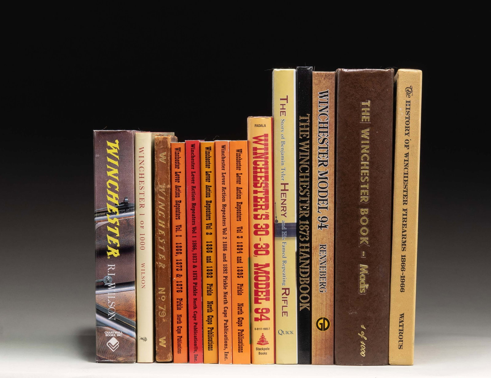 INTERESTING GROUPING OF BOOKS RELATING TO THE: WINCHESTER AND HENRY LEVER ACTION RIFLES. Group consists of 14 books, both soft and hard-cover. 1.) The Henry Rifle by Quick. / 2.) The Winchester 1873 Handbook by Stone. / 3.) Winchester Model 94 by 