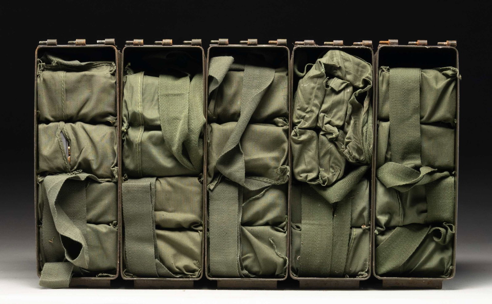 ABOUT 960 RDS. OF SURPLUS 30-06 M2 BALL AMMO.: This lot consists of about 960 rds. of 30-06 M2 ball ammo. Ammo appears to be mostly WCC (Western Cartridge Co.) mfr. with 1950's dates. Ammo is on 8-rd. en-bloc Garand clips in bandoliers & further h