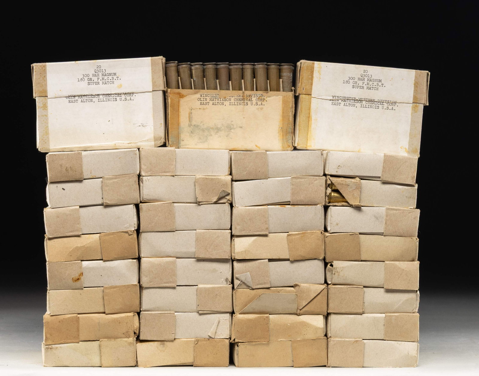 34 BOXES OF WINCHESTER-WESTERN 300 H&H MAGNUM: SUPER MATCH AMMO. 680 rds. of 180 gr. F.M.C.B.T. ammo; this ammo was used for match competition by US Army, Navy & Air Force. CONDITION: Most boxes are sealed w/ 2 boxes open. 1 Box of ammo appears cl