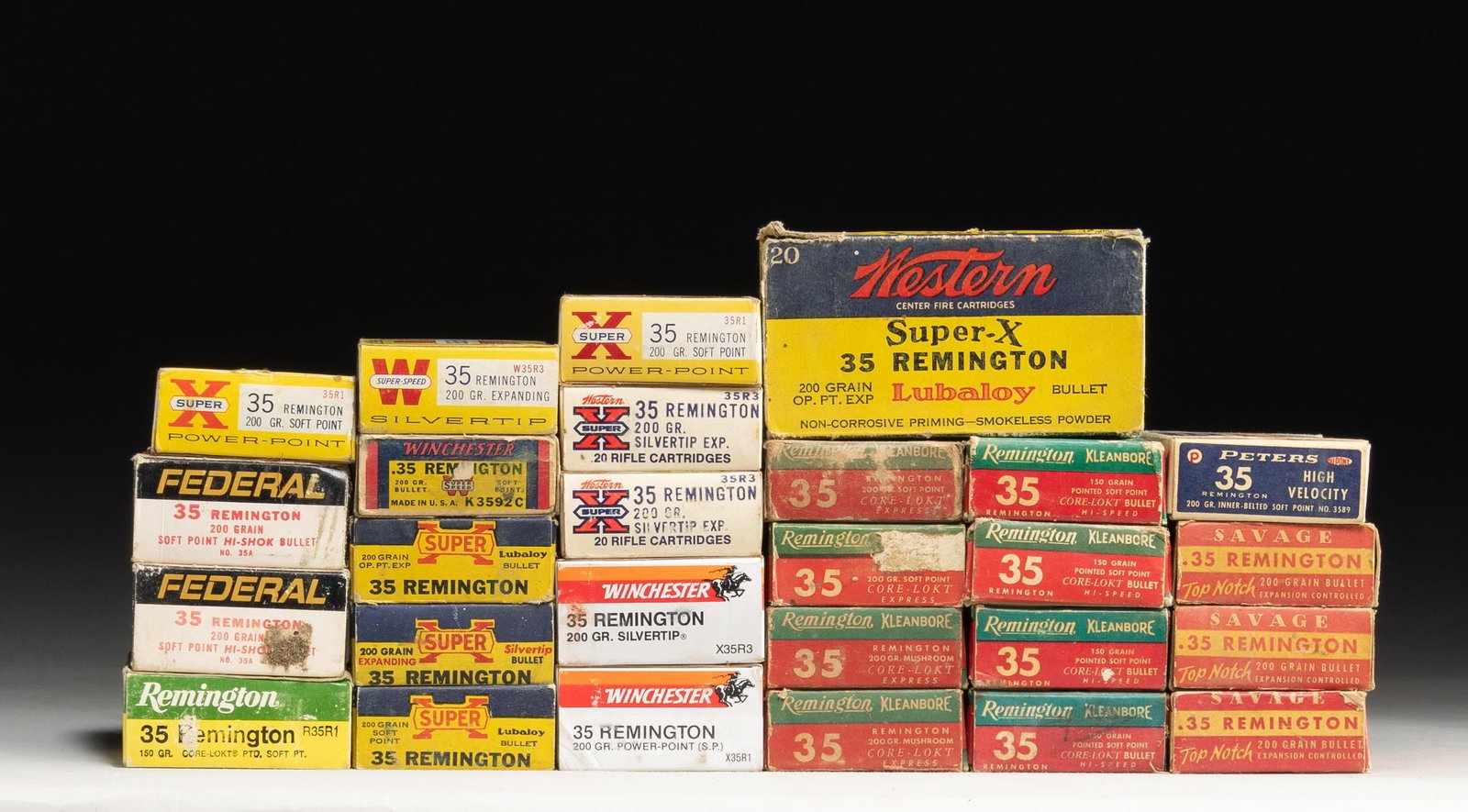 GROUPING OF 35 REMINGTON SPORTING RIFLE AMMUNITION: Lot may contain hollow points. Lot consists of: 1.) Remington. 4 green and red boxes of 20 rounds each. 200 grain soft point bullets. [80 rounds total]. / 2.) Remington. 3 green and red boxes of 20 ro