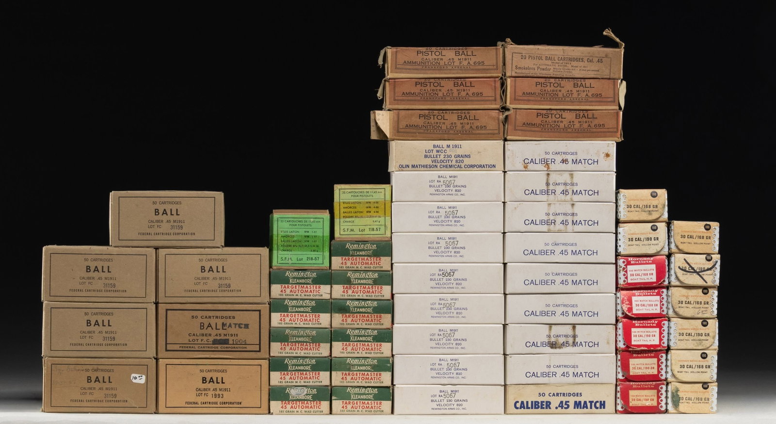 EXTENSIVE GROUPING OF 45 ACP MILITARY AND TARGET: PISTOL AMMUNITION. Lot consists of: 45 ACP: 1.) Remington Target Master. 11 boxes of 50. 185 grain wad cutter. / 2.) U.S. Match. 18 boxes of 50. Predominantly Remington. 1966. 230 grain ball. / 3.) Pr