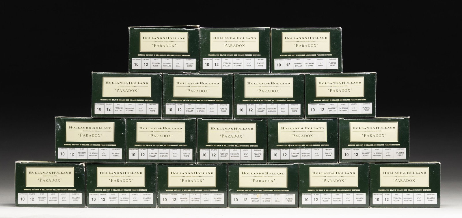 GROUPING OF 12 GAUGE HOLLAND & HOLLAND PARADOX: AMMUNITION. Lot consists of: 12 gauge Holland & Holland Paradox cartridges. 18 boxes of 10 rounds. 740 grain Fosbery bullet with plastic fibre case wads. 2 1/2" case. Headstamped "HOLLAND & HOLLAND" a