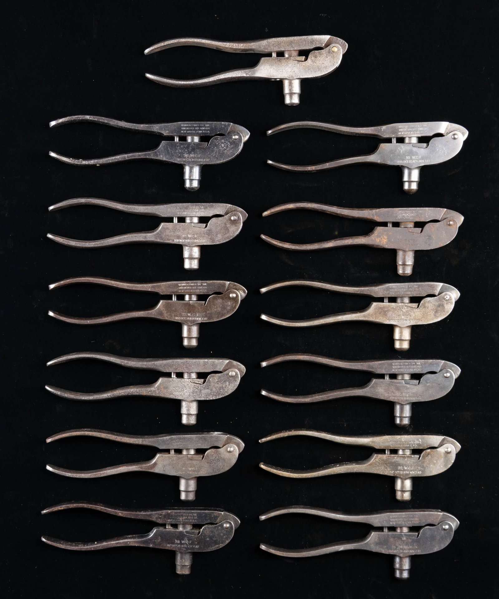 13 WINCHESTER MODEL 1882 RELOADING TOOLS.: Cals. include:7 - CAL. 32 W.C.F.2 - CAL. 38 W.C.F.1 - CAL. 22 W.C.F.1 - CAL. 44 W.C.F.1 - CAL. 25-20 MARLIN1 - CAL. 32 S&W. CONDITION: tools show varying degree of finish from good blue with deep