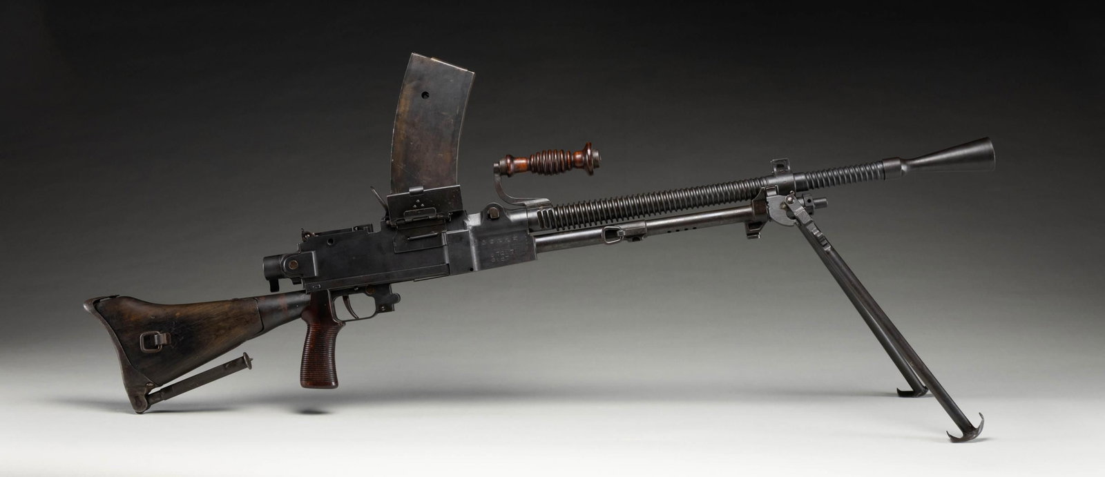 FULLY TRANSFERABLE JAPANESE TYPE 99 LIGHT MACHINE: GUN.Cal. 7.7. S# 7217. Bbl. 21 1/2" matching numbered & dated August, 1943. Blade fronts sight with protective ears. Adjustable aperture rear sight. All visible matching numbers. Right side of receive